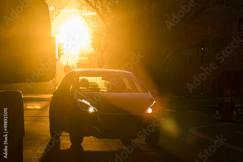 Canvas Print Stockholm, Sweden, A car driving at sunrise in silhouette.