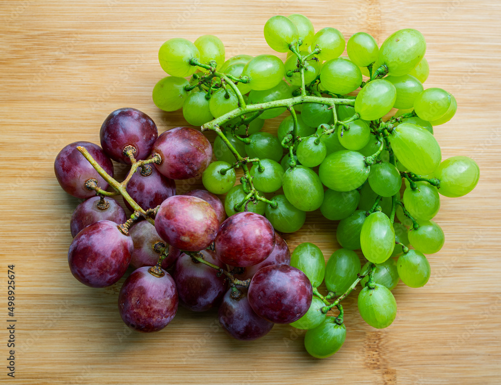 Fresh grapes on wooden background. Selective focus with shallow depth of field. Fresh grapes on wooden background. Selective focus with shallow depth of field.