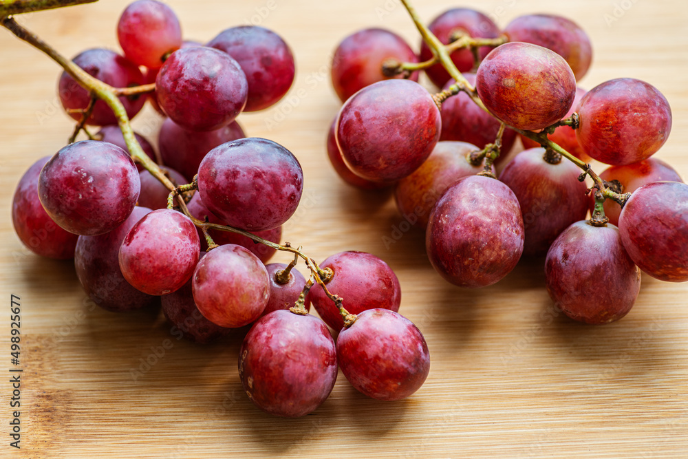 Fresh grapes on wooden background. Selective focus with shallow depth of field. Fresh grapes on wooden background. Selective focus with shallow depth of field.