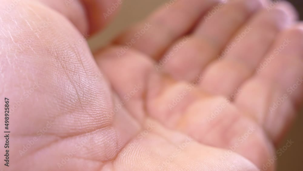 Palm hand close up. Reach out for alms. Open palm and fingers. Palm hand close up. Reach out for alms. Open palm and fingers.