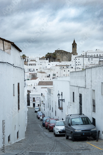 Local streets of the white Spanish Andalusian town of Vejer de la Frontera in a cloudy winter day