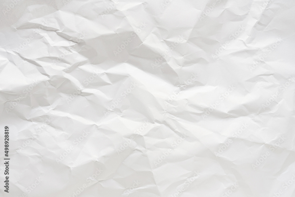 Obraz premium White crumpled paper texture background.