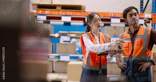 Warehouse workers discussing shipping schedule. Warehouse and Logistic business concept.