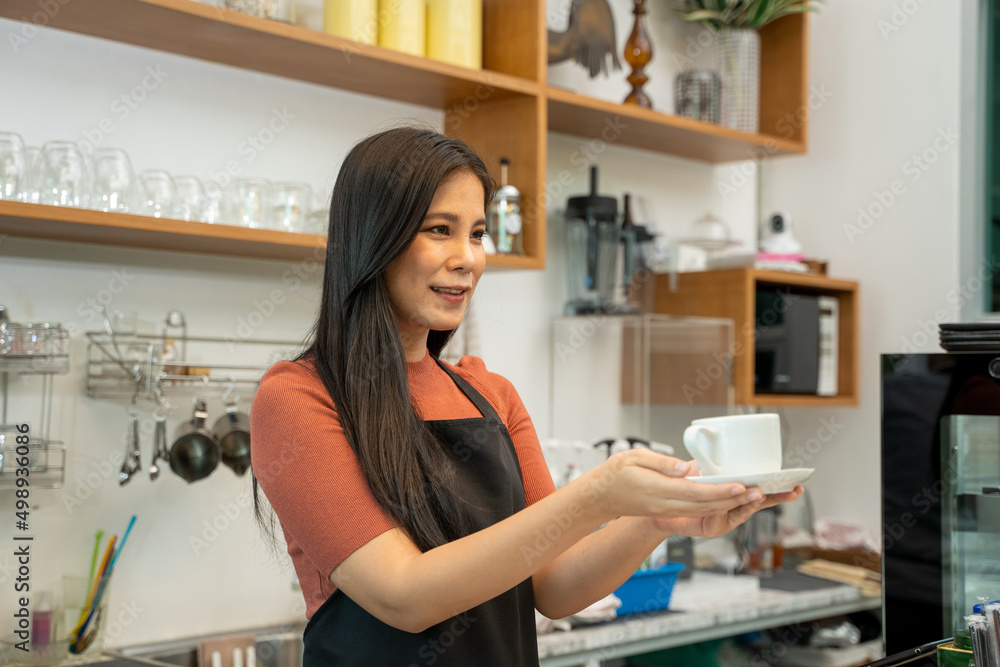 Barista in an apron making coffee in a coffee shop,Barista Cafe Coffee Grinder Pour Professional Concept. Barista in an apron making coffee in a coffee shop,Barista Cafe Coffee Grinder Pour Professional Concept.