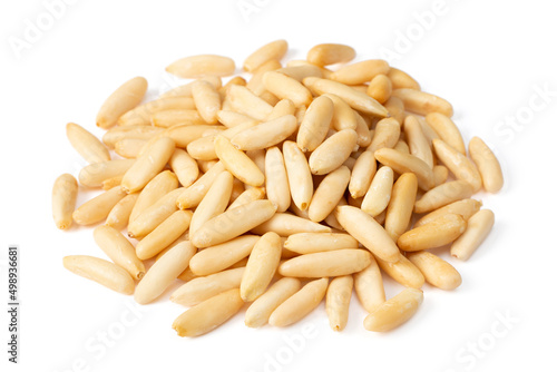 Shelled European pine nuts isolated on white background.