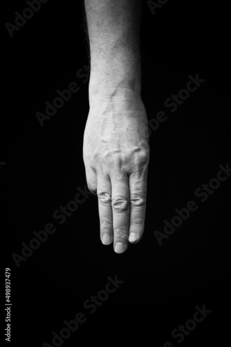 Hand demonstrating the Ukrainian sign language letter 'Т'.