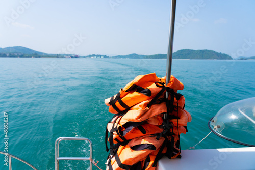 Life jackets for boat wearing diving suit.