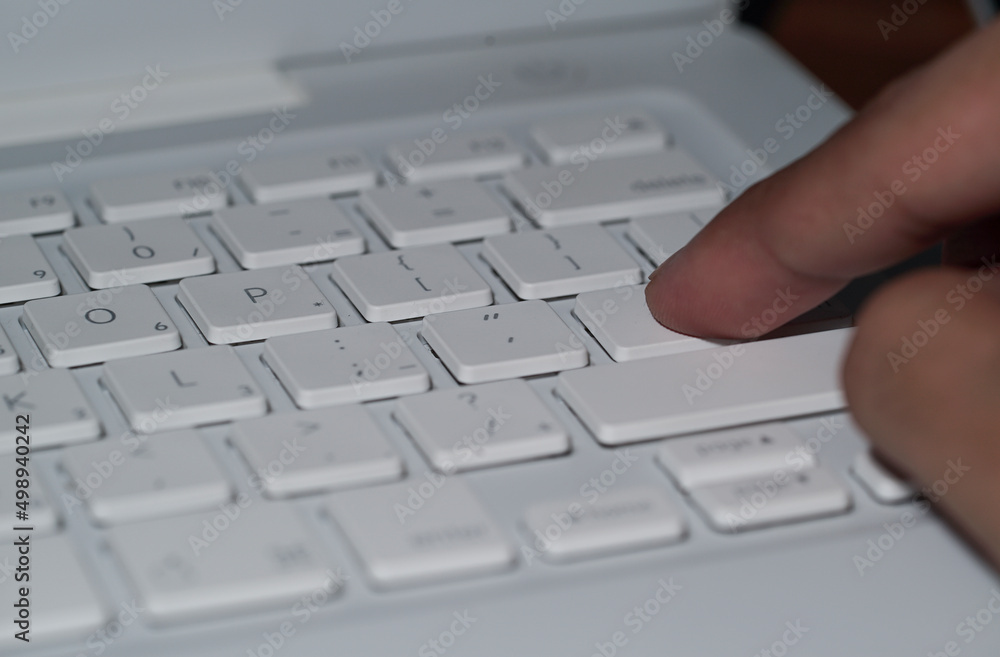 Close up on fingers texting on a computer keyboard Close up on fingers texting on a computer keyboard