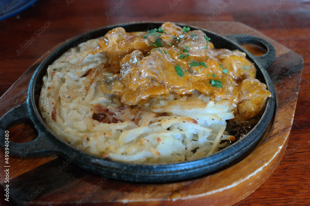 Rosti is a Swiss dish consisting mainly of potatoes, pan-fried or deep-fried Rosti is a Swiss dish consisting mainly of potatoes, pan-fried or deep-fried