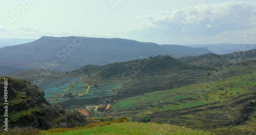 Mountainous And Greenery Agriculture Fields In Maestrazgo Region In Spain. Aerial Wide Shot photo