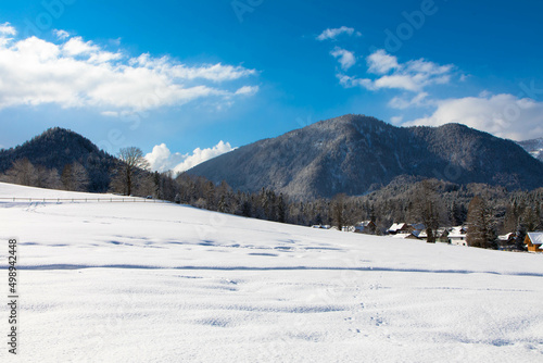 Winter day in austrian alpine ski resort with cloudy sky and bright white snow. Steiermark, Upper Austria