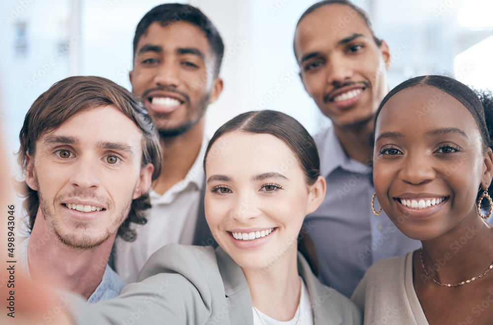 Your smile brightens up someones day. Shot of a group of businesspeople taking a selfie at work. Your smile brightens up someones day. Shot of a group of businesspeople taking a selfie at work.