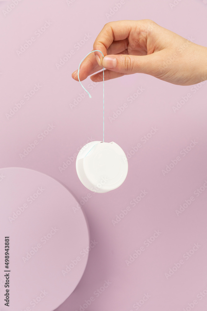 floss hand product package on pink background floss hand product package on pink background