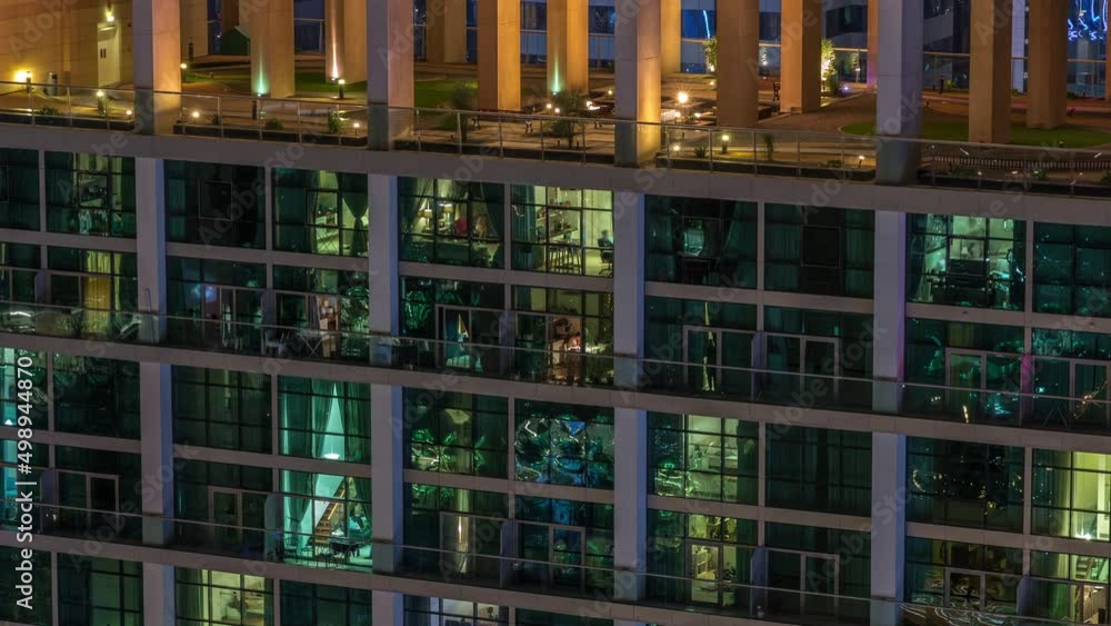 Big glowing windows in modern office and residential buildings timelapse at night Big glowing windows in modern office and residential buildings timelapse at night