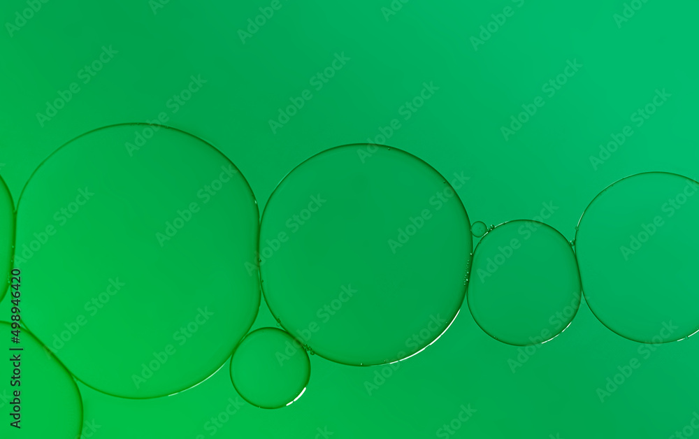 Abstract oil bubbles on lime green light effects background. Abstract oil bubbles on lime green light effects background.