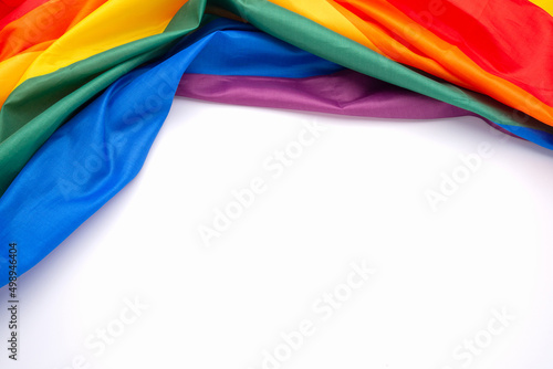Top view of the rainbow flag or LGBT over a white background
