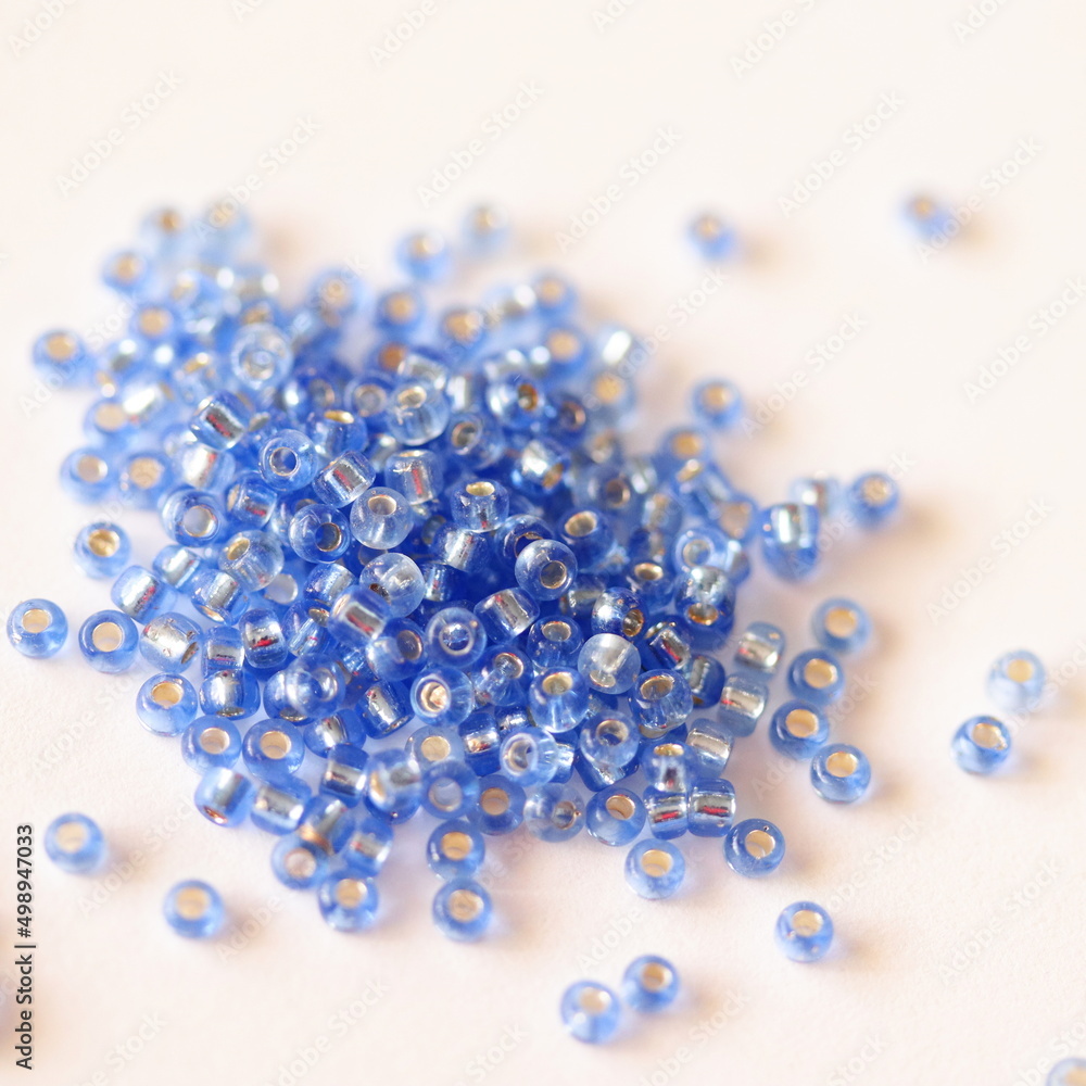 Glass beads. Blue color. Isolated on white background. Glass beads. Blue color. Isolated on white background.