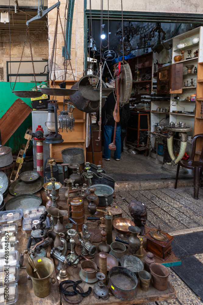 A small shop selling antique kitchen utensils is located in the market in Nazareth, northern Israel A small shop selling antique kitchen utensils is located in the market in Nazareth, northern Israel