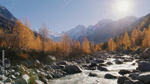 beatiful nature scenery in switzerland with glacier, mountains and river in autumn