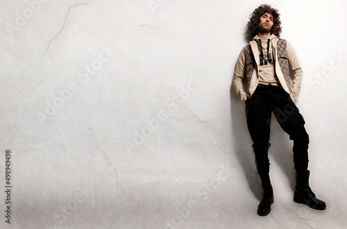 Bilde på lerret Fashion Model Poses against the wall in Greek Islan Mykonos