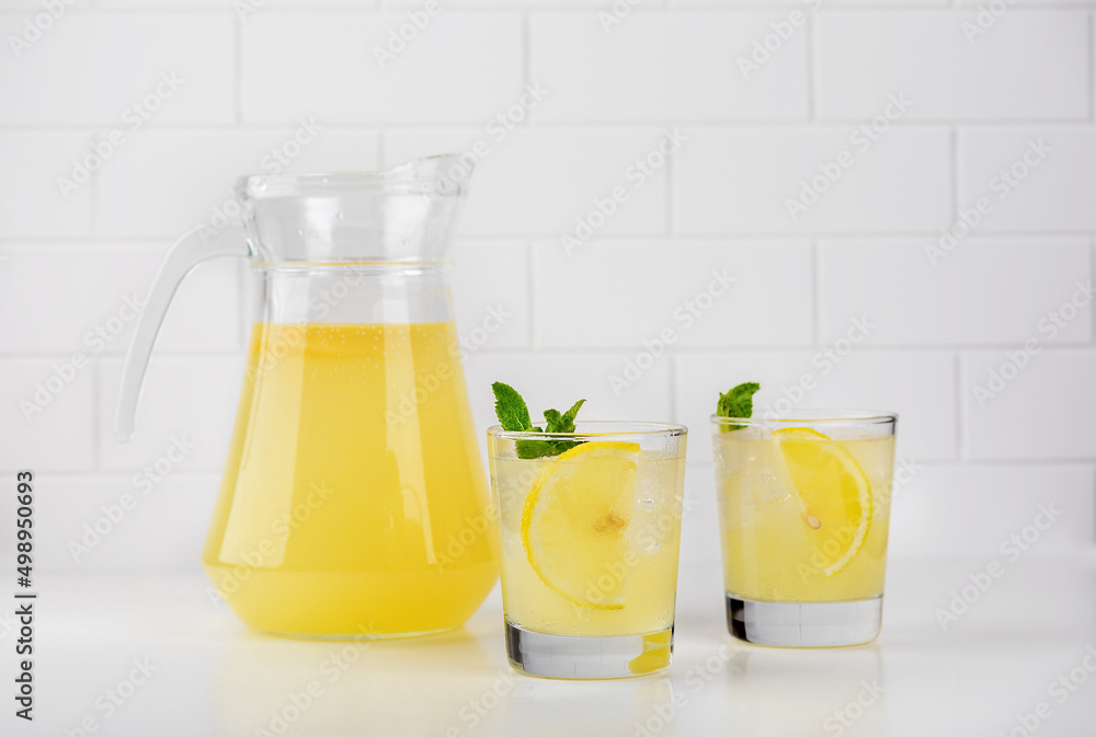 glass of orange juice and lemon glass of orange juice and lemon