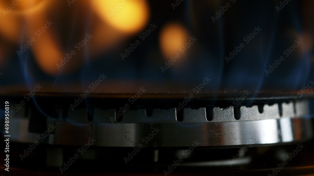 Gas is switching on, apearing blue flame. Macro shot. Gas is switching on, apearing blue flame. Macro shot.