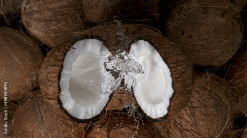 Cracked coconuts falling, f...