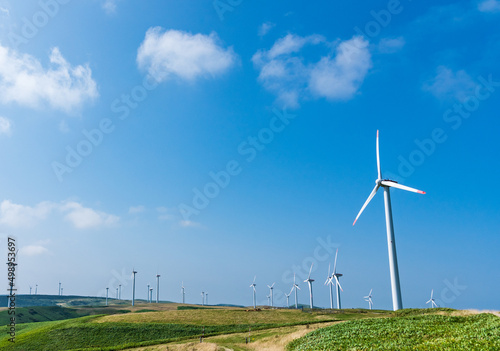青空と風力発電の風車 再生可能エネルギーのイメージ  北海道稚内市 photo