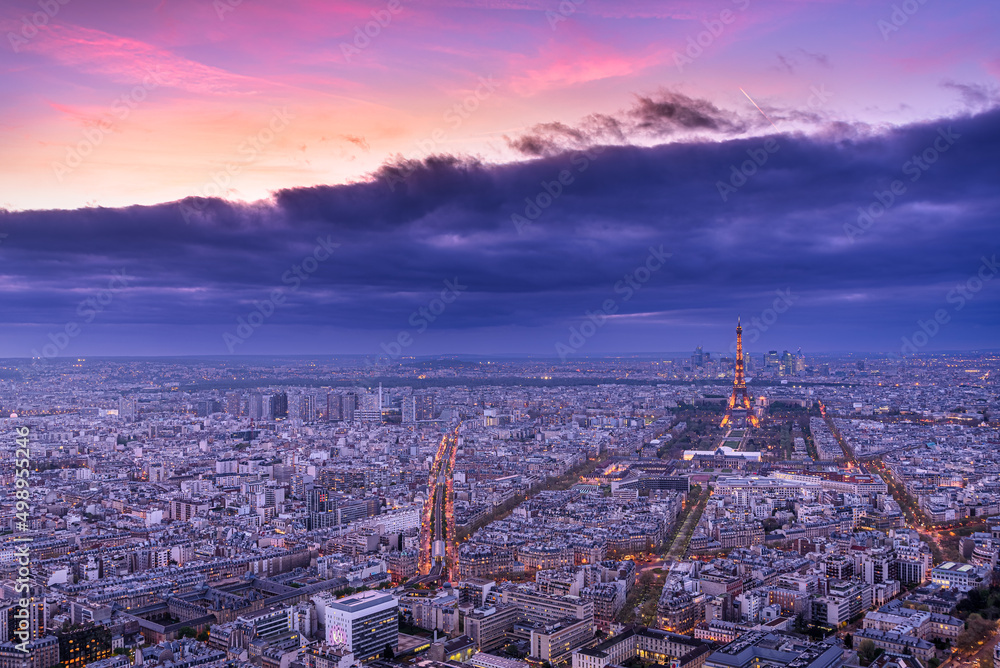 Paris cityscape by twilight with the illuminated Eiffel Tower shot from the top of the Tour Montparnasse 