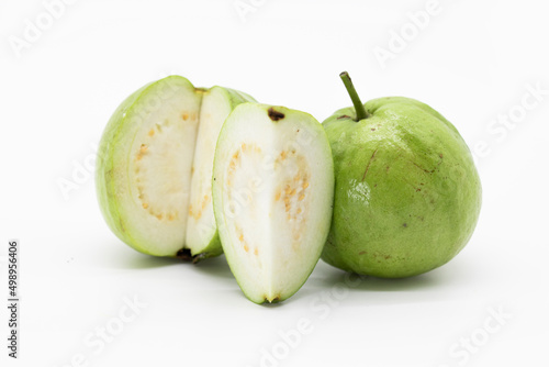 whole and slices fresh guava isolated on white background