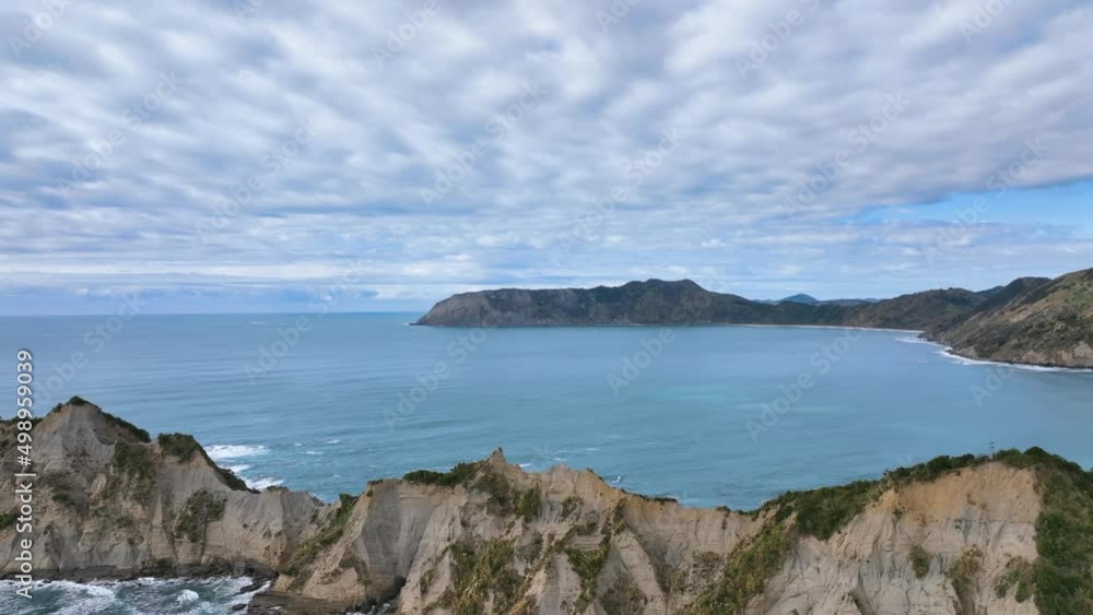 Flight close over the dramatic serrated ridge line of Motuoroi Island - NZ Flight close over the dramatic serrated ridge line of Motuoroi Island - NZ
