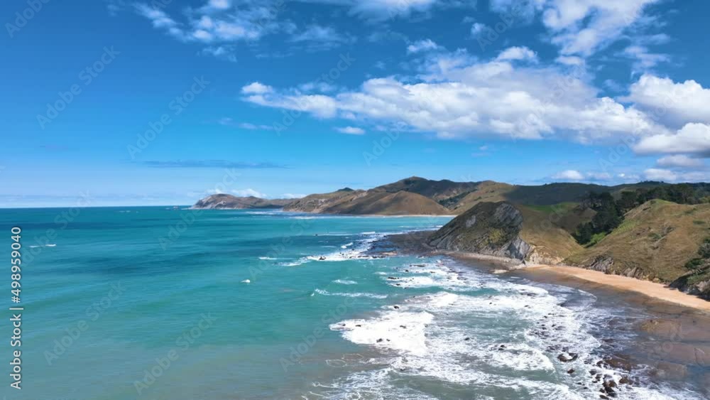 Aerial descends over turquoise seas and vast reef forms of Waihau Bay - NZ Aerial descends over turquoise seas and vast reef forms of Waihau Bay - NZ
