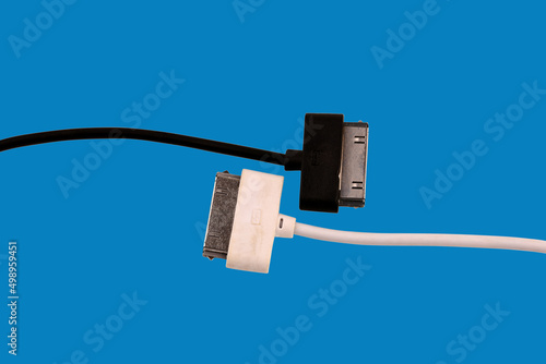 Black and white USB ports. Isolated on a blue background.