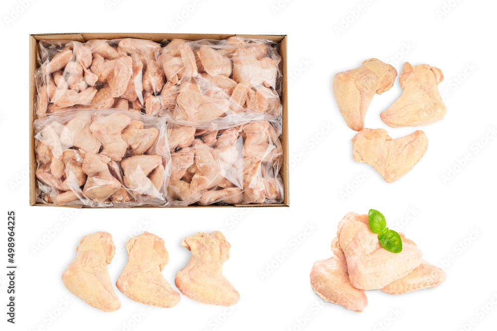 Fototapeta premium Raw, frozen chicken wings in a cardboard box on an isolated white background. Top view. Copy space.Industrial chicken selling and producing.
