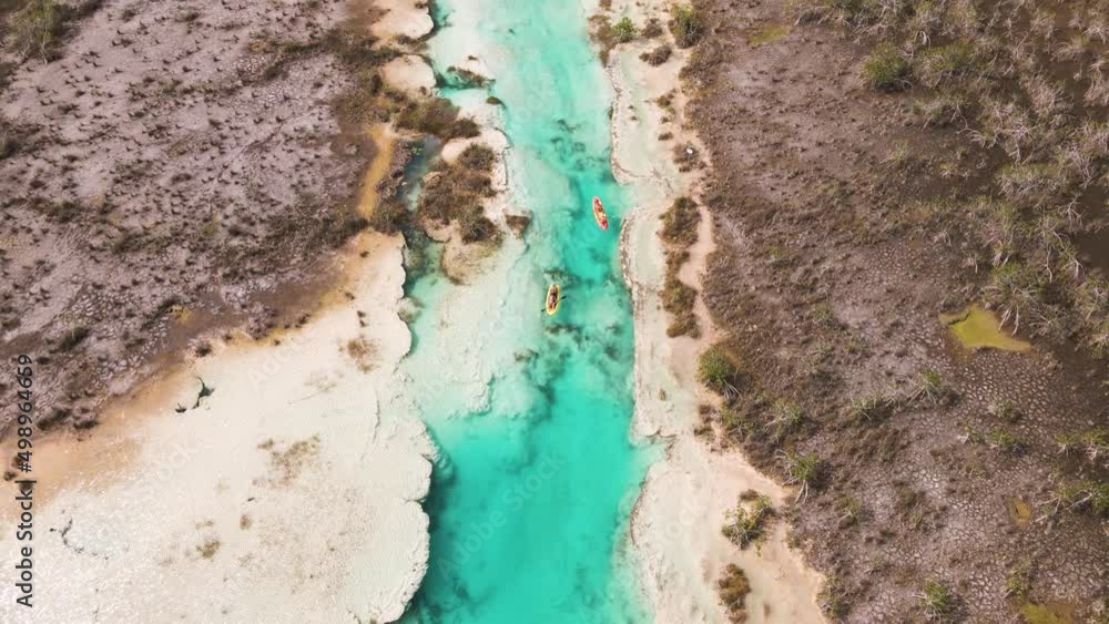 Upwards panning drone shot of kayakers revealing the scenic view of Upwards panning drone shot of kayakers revealing the scenic view of