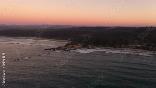 Yoakam Point and Bastendorff Beach near Cape Arago and Coos Bay, Oregon Coast. Drone aerial at sunset, wide shot of coastline. photo