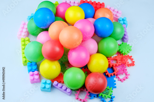 Colorful children's toy balls and puzzle blocks. Disassembly of children's toys