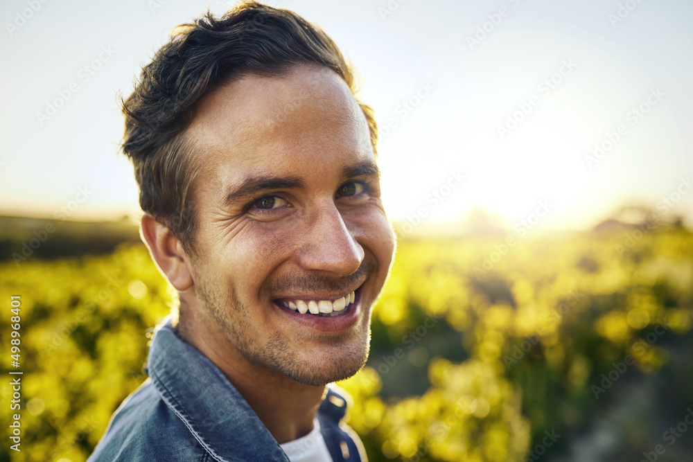 Its the season for some pickin. Portrait of a happy young man working on a farm. Its the season for some pickin. Portrait of a happy young man working on a farm.