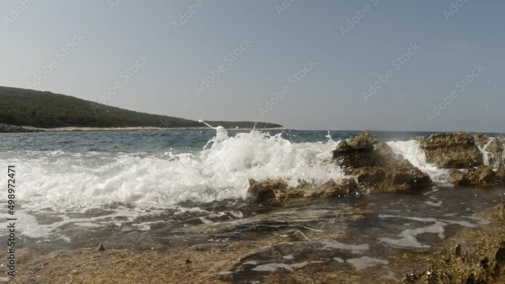 Ocean Waves Splashing Through The Rocky Shoreline Of Paralia Emplisi Kefalonia Greece, Europe- Static Shot Ocean Waves Splashing Through The Rocky Shoreline Of Paralia Emplisi Kefalonia Greece, Europe- Static Shot