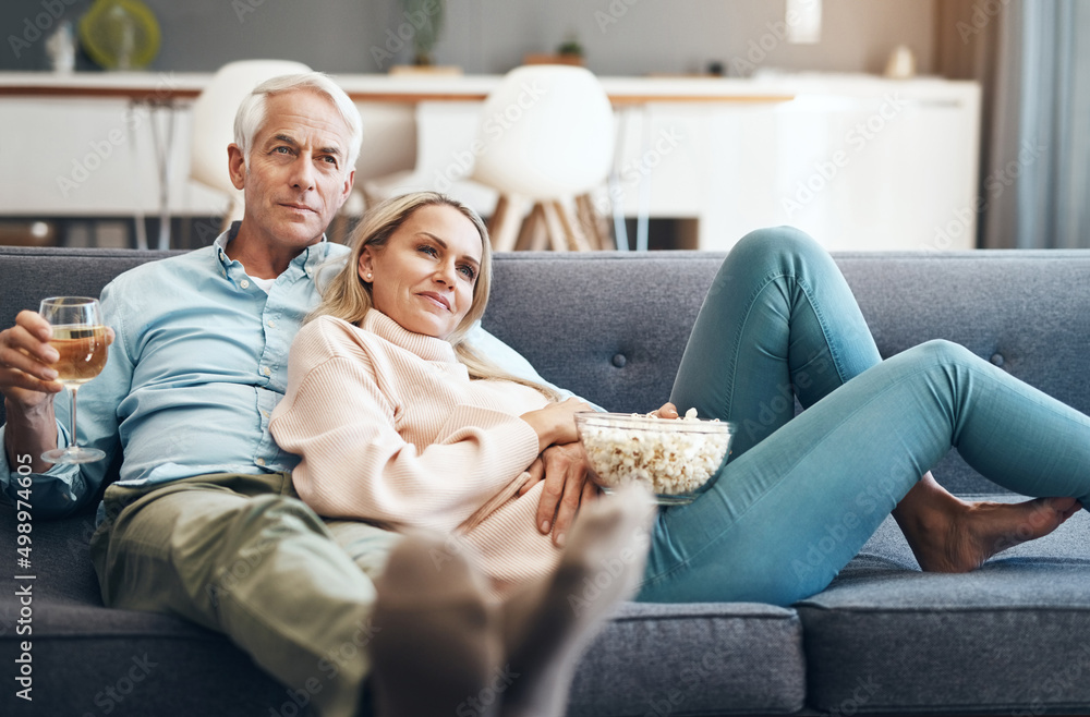 Bonding with some quality time is important to us. Cropped shot of an affectionate mature couple relaxing on the sofa at home. Bonding with some quality time is important to us. Cropped shot of an affectionate mature couple relaxing on the sofa at home.
