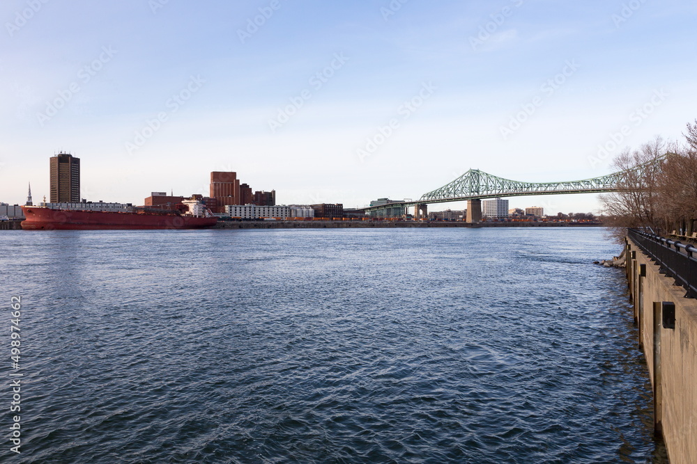 The St. Lawrence River, the 1930 cantilever Jacques-Cartier Bridge and skyline seen in late fall from Saint Helen’s Island, Montreal, Quebec, Canada