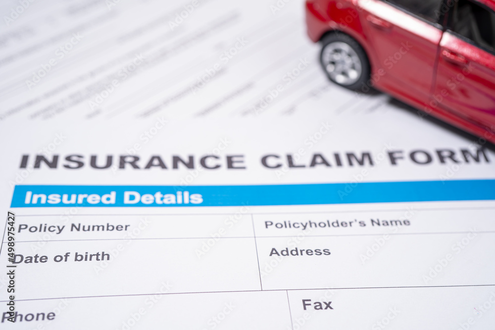 Red car on Insurance claim accident car form, Car loan, insurance and leasing time concepts. Red car on Insurance claim accident car form, Car loan, insurance and leasing time concepts.
