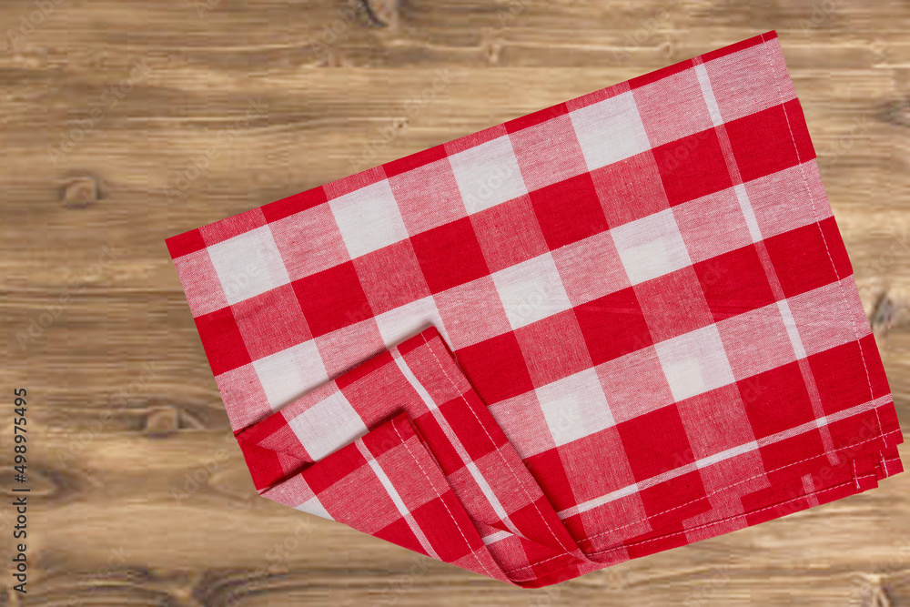 Empty table product. Top view of a rustic wooden table with a red and white checkered tablecloth or napkin. Template for your food and product display montage. Space for food recipe. Empty table product. Top view of a rustic wooden table with a red and white checkered tablecloth or napkin. Template for your food and product display montage. Space for food recipe.