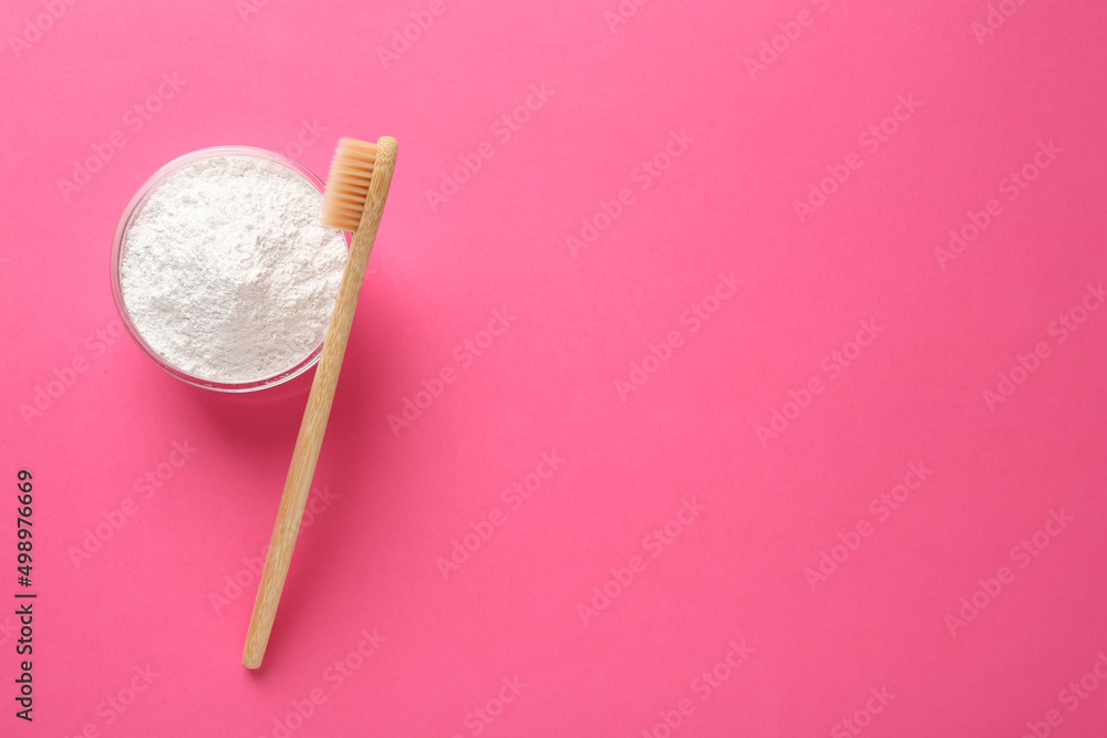Bowl of tooth powder and brush on pink background, flat lay. Space for text Bowl of tooth powder and brush on pink background, flat lay. Space for text