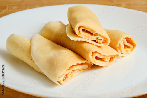 Crepes with marmalade on plate