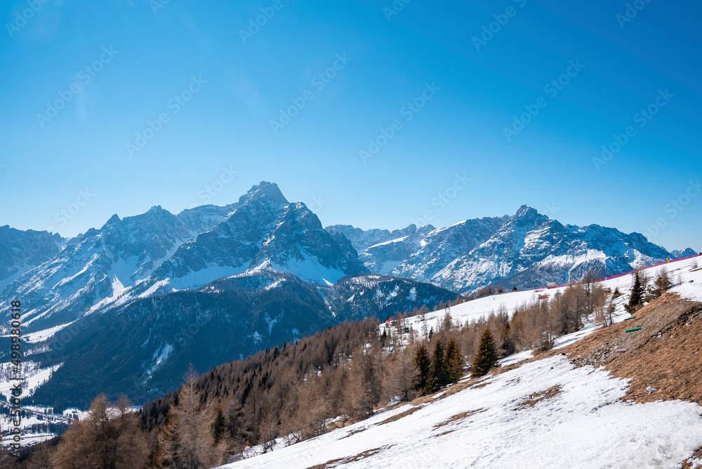 Idyllic view of majestic kronplatz mountain range and trees against clear sky