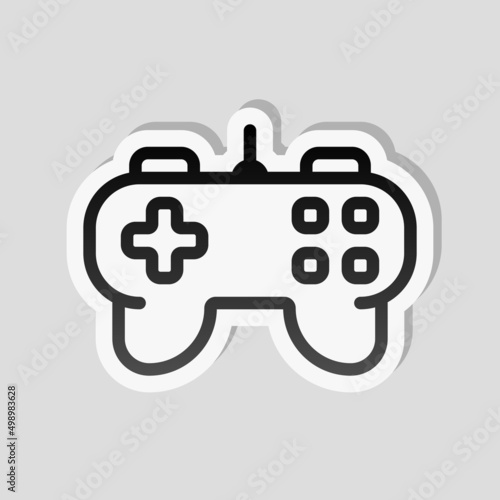 Joystick of video console, game controller, simple icon. Linear sticker, white border and simple shadow on gray background