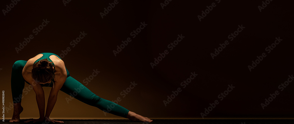 Doing some stretches on the ground while focusing Doing some stretches on the ground while focusing