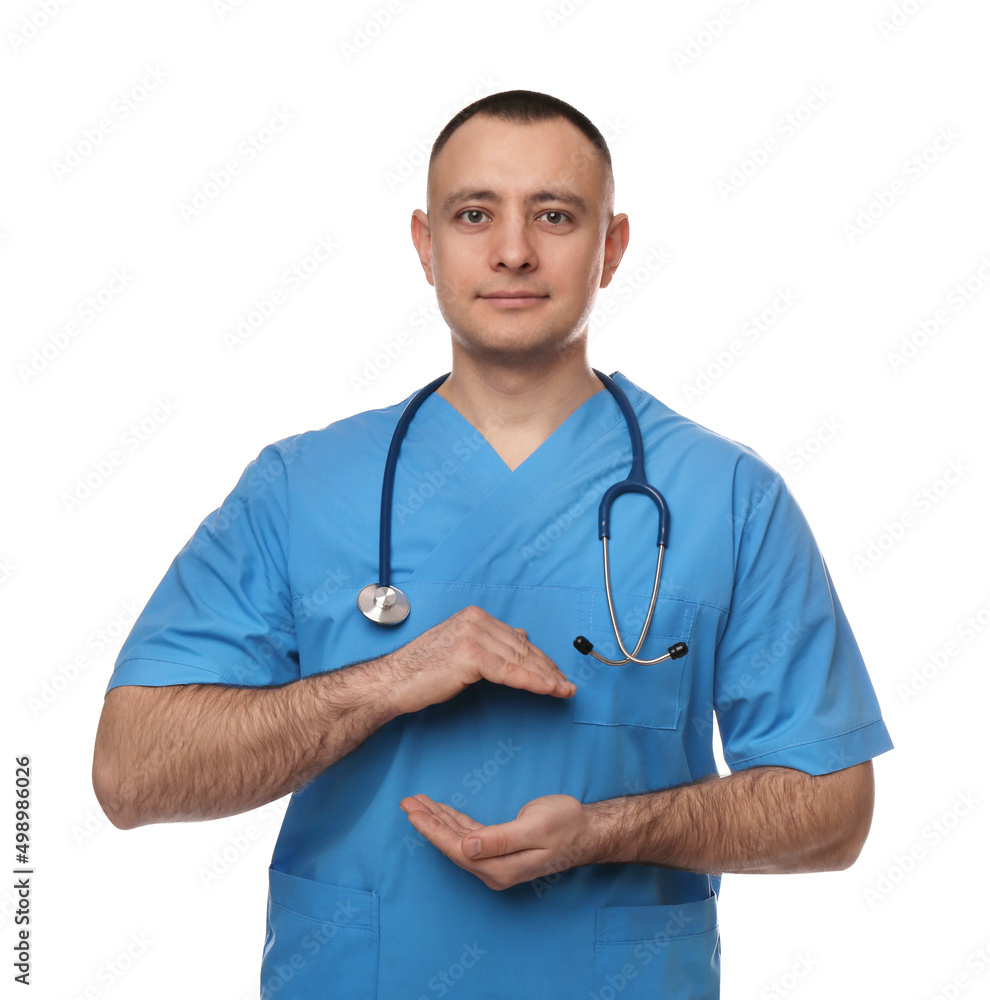 Doctor with stethoscope holding something on white background. Cardiology concept Doctor with stethoscope holding something on white background. Cardiology concept