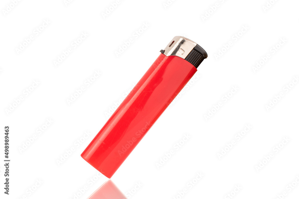 One red lighter, close-up, isolated on a white background. One red lighter, close-up, isolated on a white background.
